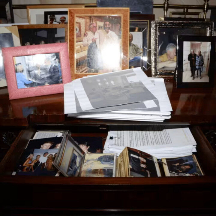 epstein files image of desk with photographs